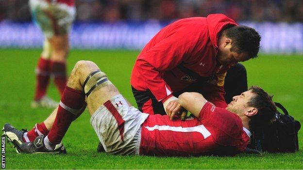 Wales back-row Ryan Jones receives treatment