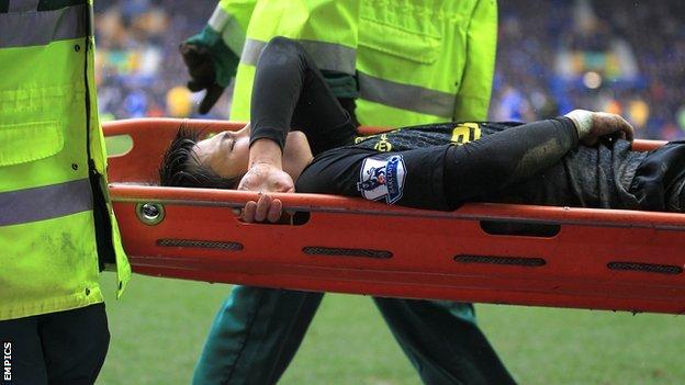 Wigan's on-loan winger Ryo Miyaichi is carried off on a stretcher against Everton