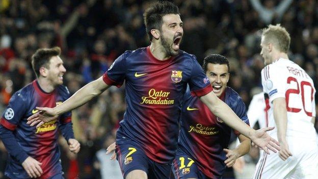 David Villa celebrates scoring for Barcelona against AC Milan