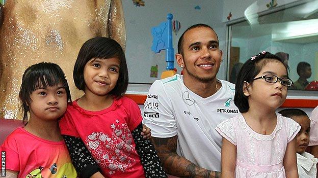 Lewis Hamilton visits a children's hospital