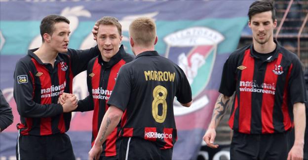 Timmy Adamson scored twice as Crusaders won a dramatic game against Glentoran at the Oval