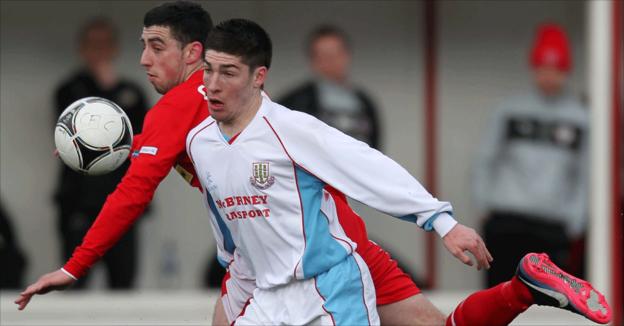 Joe Gormley and Michael Ruddy in action as Cliftonville beat Ballymena United 5-0 at Solitude