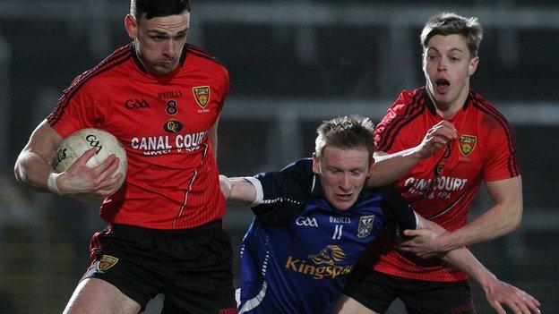 Down's Conor Gough and Jerome Johnston in action against Chris Conroy of Cavan