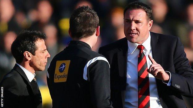 Cardiff City manager Malky Mackay reacts to fourth official Lee Collins as Watford boss Gianfranco Zola shuts his eyes to the issue