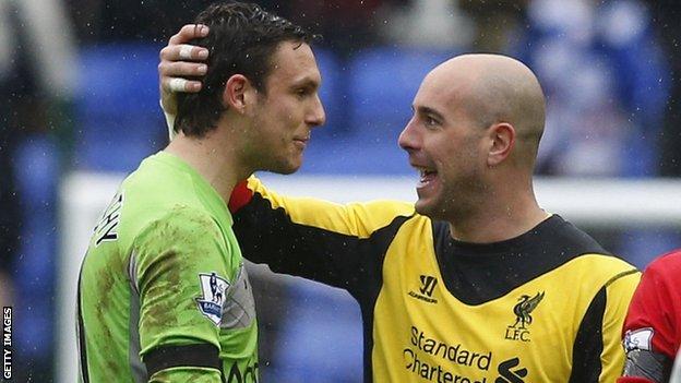 Reading goalkeeper Alex McCarthy with Liverpool's Pepe Reina