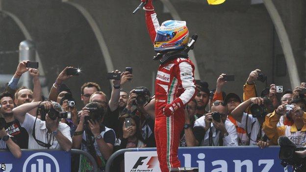 Fernando Alonso celebrates after winning the Chinese Formula One Grand Prix