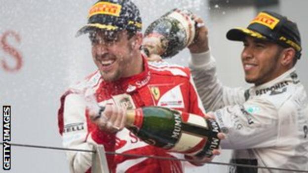 Fernando Alonso (left) with Lewis Hamilton
