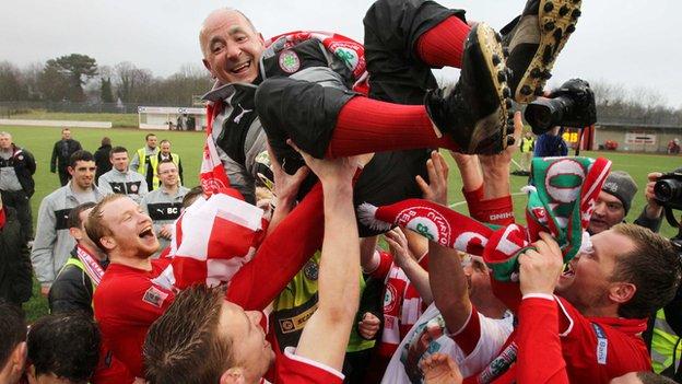 Tommy Breslin celebrates the title triumph with his Cliftonville team