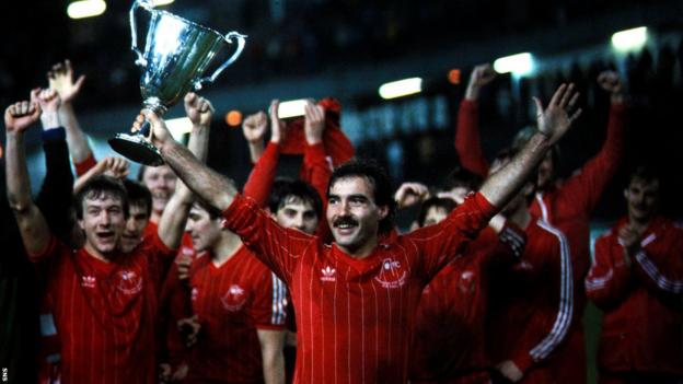 Captain Willie Miller gets his hands on the European Cup Winners' Cup trophy.