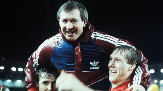 Dons manager Alex Ferguson joins in the celebrations at full-time.