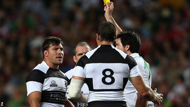 Barbarians hooker Schalk Brits (left) is yellow carded after punching Owen Farrell