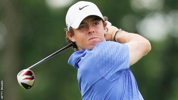 Rory McIlroy drives at the first hole in the third round