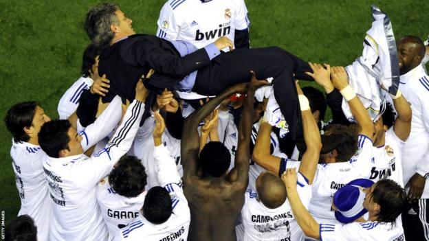Jose Mourinho celebrates with his Real Madrid players