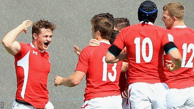 Wales U20 full-back Hallam Amos (left) celebrates his first-half try against Argentina