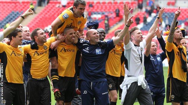 Newport players celebrate securing promortion at Wembley
