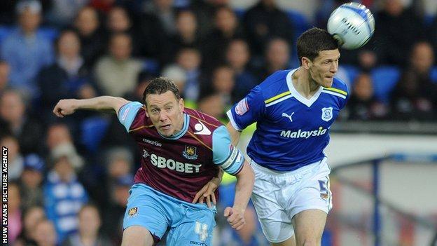 Kevin Nolan of West Ham and Mark Hudson of Cardiff City compete during the 2012 Championship Play-Off semi-final first leg