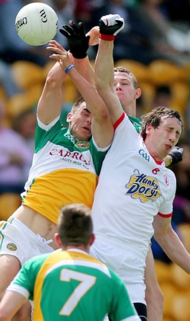 Offaly duo Eoin Carroll and Alan McNamee contest a high ball with Tyrone midfielder Colm Cavanagh in the All-Ireland SFC first-round qualifier at Tullamore