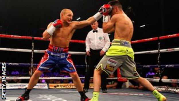 Anthony Crolla (right) covers up against Gavin Rees