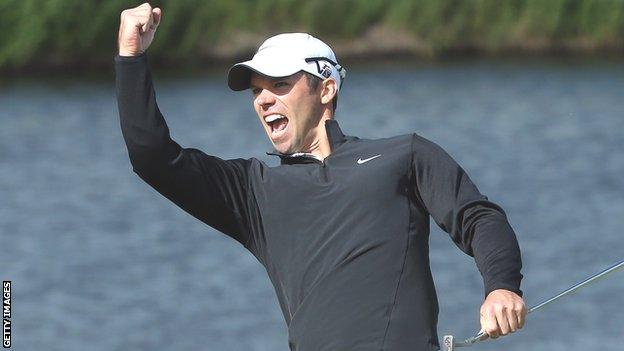 Paul Casey celebrates after holing for an eagle at the 18th