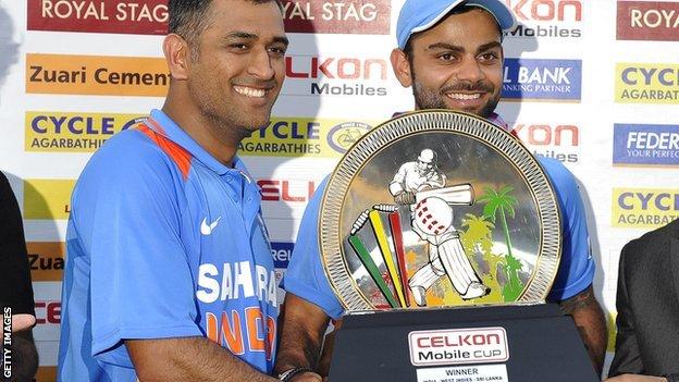 India's Mahendra Dhoni and Virat Kohli with the tri-series trophy
