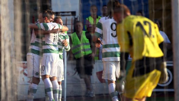 Mikael Lustig celebrates with Celtic team-mates after scoring the opening goal against the Irish Premiership champions