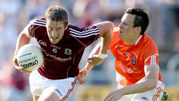 Galway's Gary O'Donnell tries to escape the clutches of Armagh's Mark Shields at Salthill