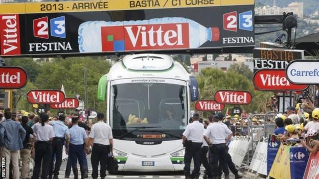 The Orica GreenEdge team bus stuck beneath the finish line on stage one