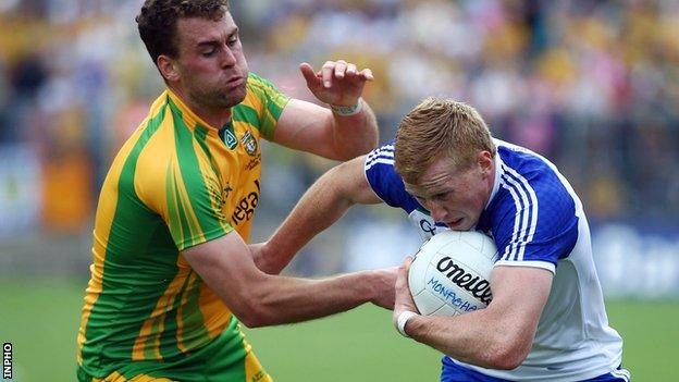 Donegal defender Eamon McGee attempts to halt outstanding Kieran Hughes at Clones