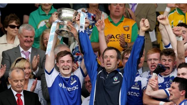 Monaghan minor captain Kevin Loughran collects the cup after his side mount a stunning comeback against Tyrone