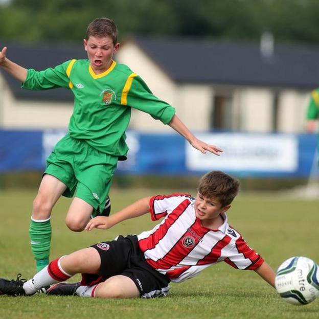 Donegal's Joe McGill and Sam Green of Sheffield United compete in the Under-13 match which ended 0-0