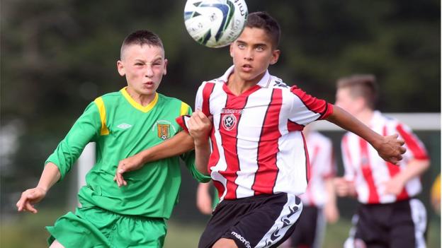 Donegal's Corey Lee Bogan and Sheffield United's Harley Brown keep their focus on the ball