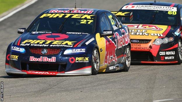 Casey Stoner (number 27) drives his Red Bull Pirtek Holden during race two of round two in the V8 Supercars Dunlop Development Series in Perth, Western Australia