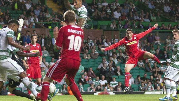 Cliftonville substitute Joe Gormley sees his powerful shot blocked close to the Celtic line