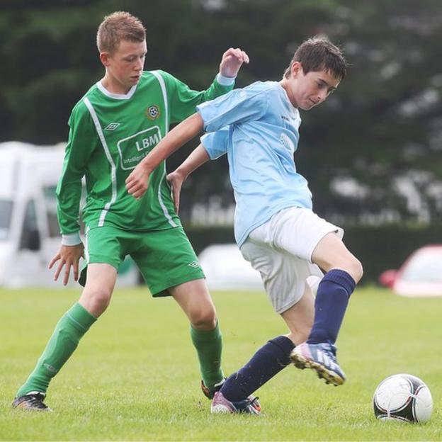 Shankill's Kyle Ferguson contests possession against Nathan Beckett of Enniskillen Town