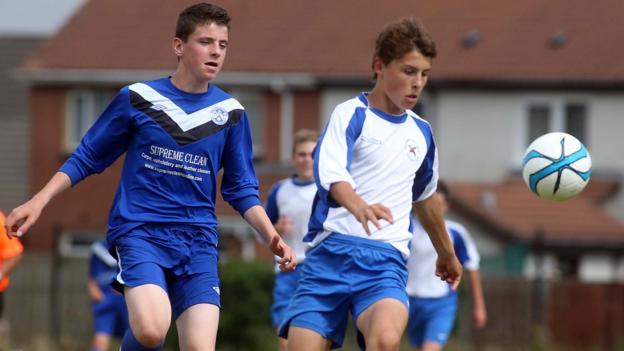 Ballinamallard's Jonathan Cassidy and Callum Howard of Ballymoney in Under-14 action at the Foyle Cup tournament