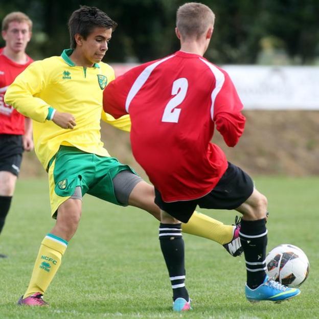 Norwich's Fernando Bell-Toxtle challenges Derry opponent Travis Hetherington during an Under-15 group fixture
