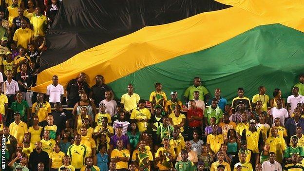 Jamaica fans watch their team play