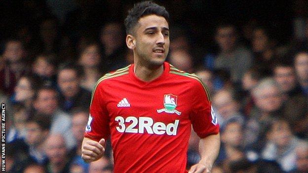 Neil Taylor playing for Swansea on his return from injury