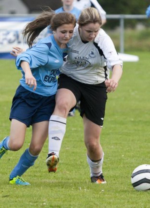 Lagan's Zoe McGlynn is challenged by Kilmacrennan's Roisin Friel in the Ladies Final at the Foyle Cup