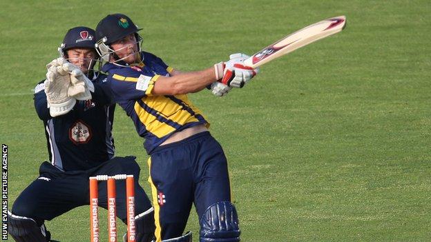 Chris Cooke hits a four against Northants