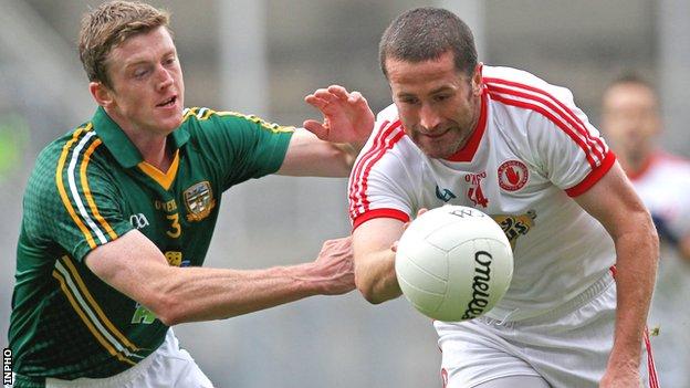 Meath's Kevin Reilly challenges Tyrone forward Stephen O'Neill