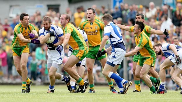 Donegal pair Rory Kavanagh and Neil Gallagher tackle Billy Sheehan in the qualifier against Laois at Carrick-on-Shannon