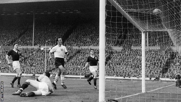 Jimmy Greaves scores his second and England's third goal after Frank Haffey spills the ball into his path