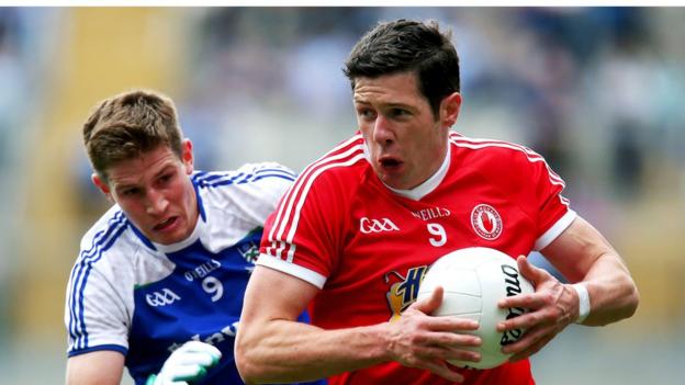 Darren Hughes prepares to challenge Sean Cavanagh as the Red Hands defeat the Farney county