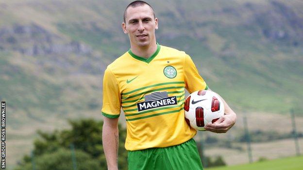 Celtic captain Scott Brown models the team's new away kit