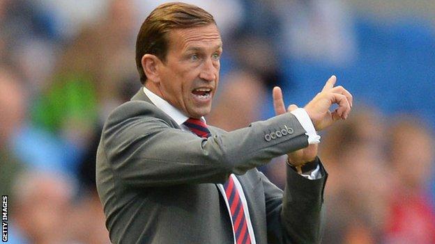 Justin Edinburgh issues instructions to his players at Brighton