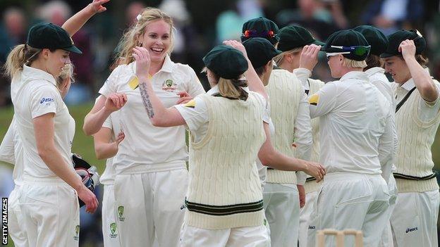 Australia celebrate a wicket by Holly Ferling