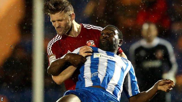 Darren Ward (left) and Jabo Ibehre battle for the ball