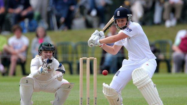 England's Heather Knight hits out watched by Australia wicketkeeper Jodie Fields