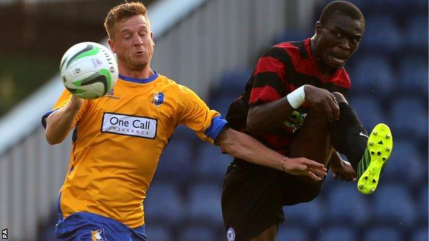 Gabby Zakuani (right) battles with Mansfield's Lee Stevenson